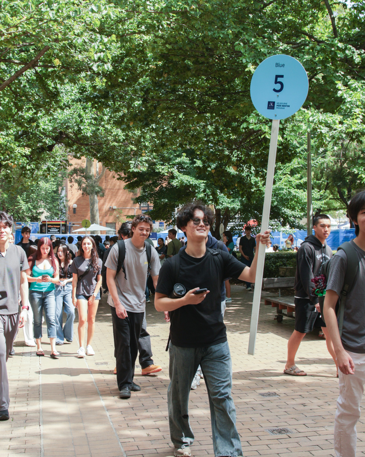 Students on a campus tour at O Week at UniMelb (2026)