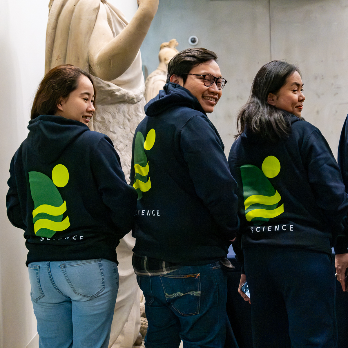 UniMelb graduate students showing off their new hoodies at O Week (2024)